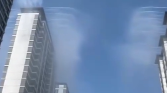 法媒点赞中国小区楼顶“人工降雨”